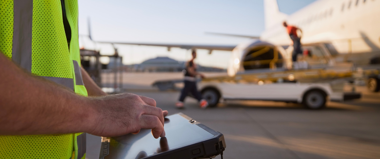 Member of ground crew preparing airplane before flight