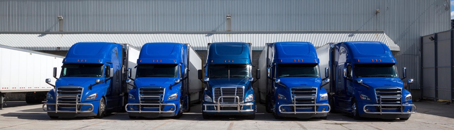 Front view of five semi trucks